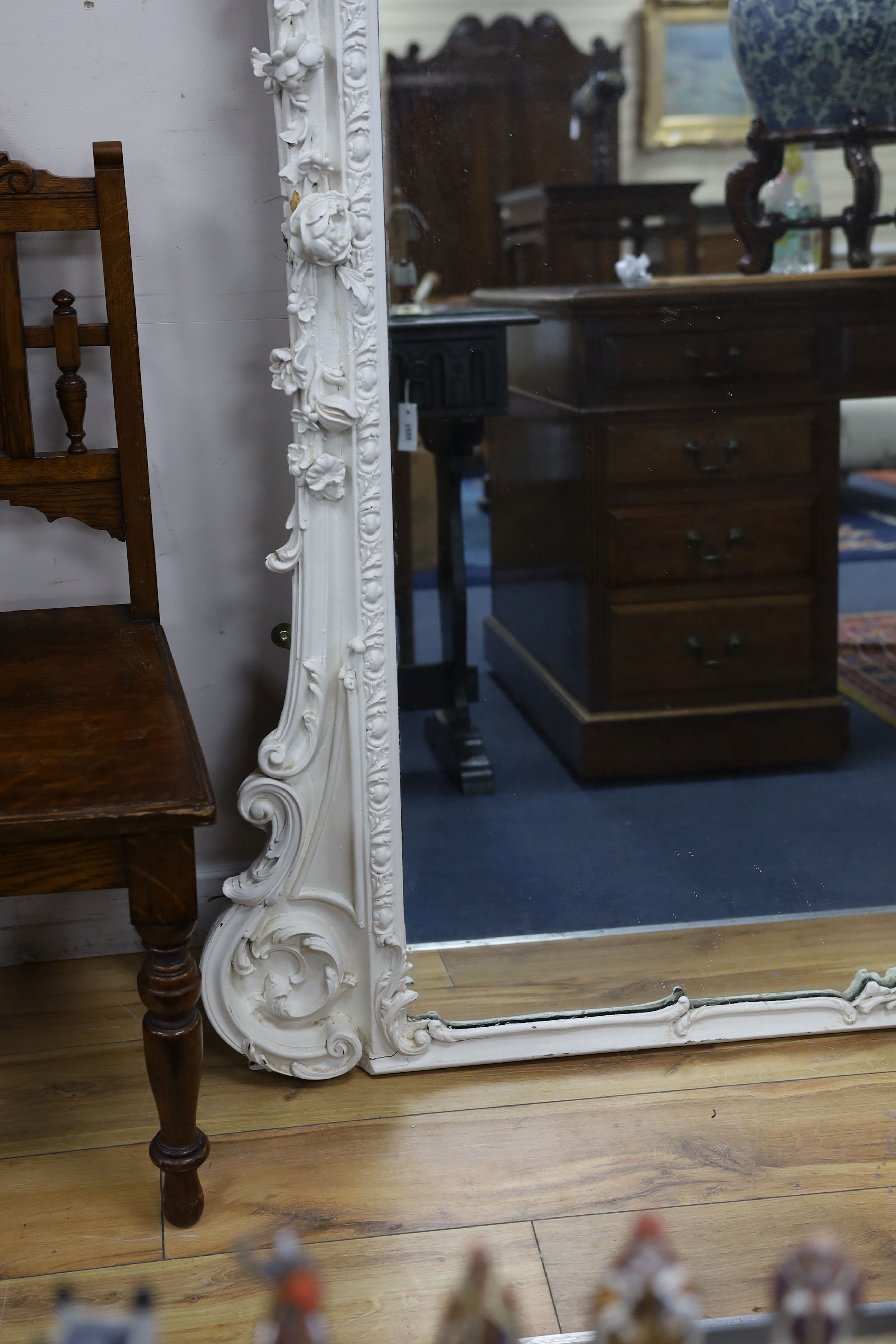 A Victorian carved giltwood and gesso overmantel mirror, later painted white, width 138cm, height 177cm